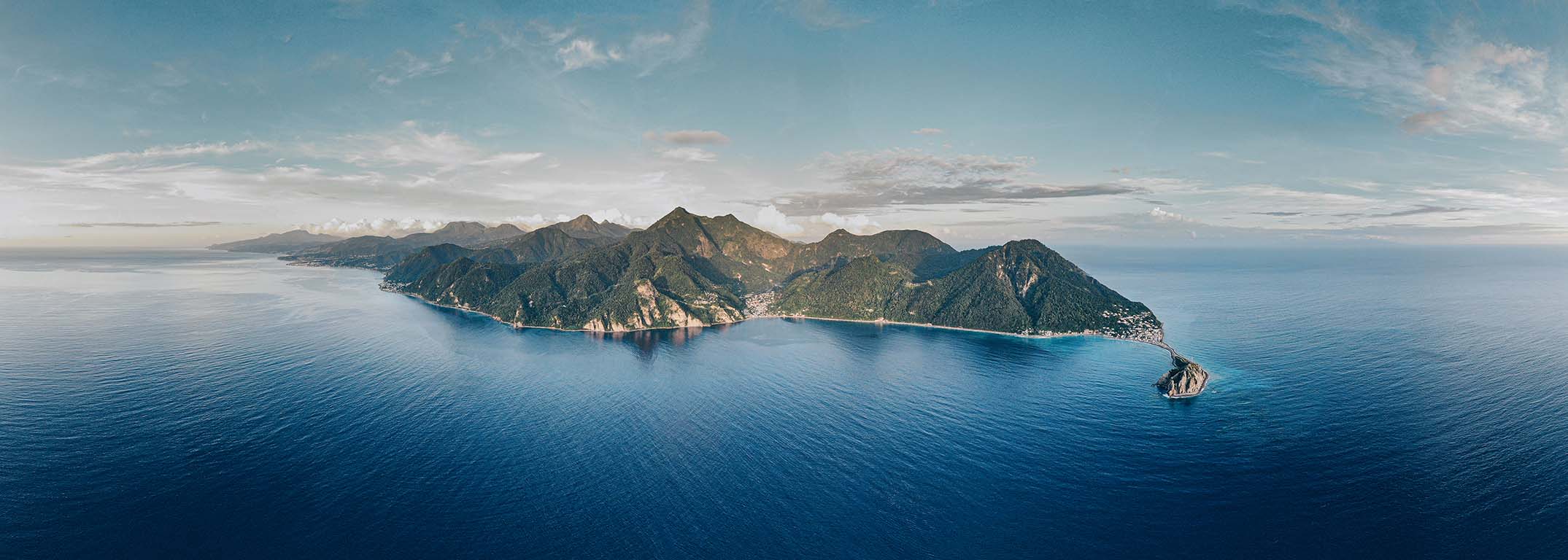 Aerial of Scott's Head — the peninsula reaching into the deep blue at the southern tip of Dominica